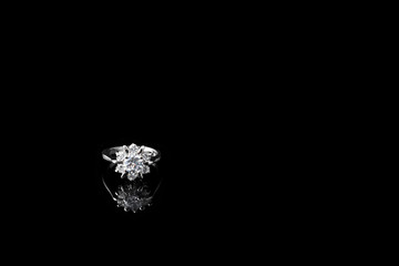 Luxury jewellery. White gold or silver ring with diamonds. Selective focus