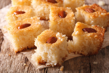 delicious cake with almonds basbousa macro. horizontal
