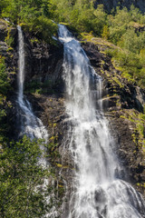 Fototapeta na wymiar Waterfall in mountains, Norway