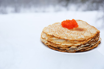stack of pancakes with caviar