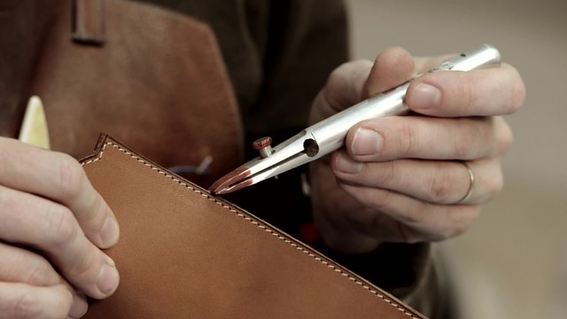 Trunk Maker at work in his luxury leather workshop