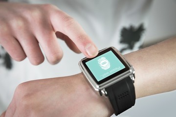 Composite image of woman using smartwatch