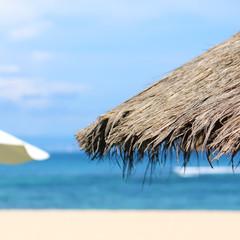 Fototapeta na wymiar Umbrellas on the beach near the sea
