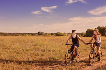 Fototapeta premium young couple having a bike ride in nature