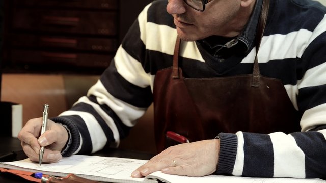 Trunk Maker at work in his luxury leather workshop