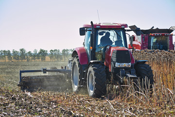 Naklejka premium Agricultural machinery working in the field