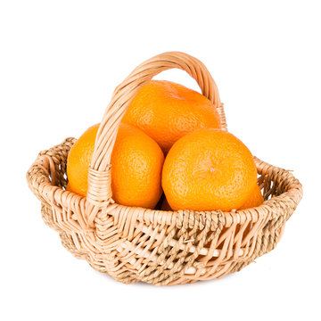 Tangerines in basket isolated on white