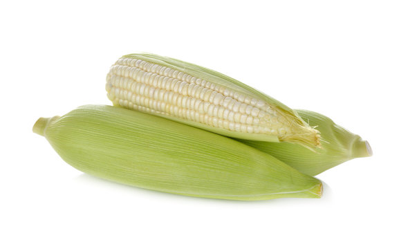 uncooked white corn wil leaf on white background