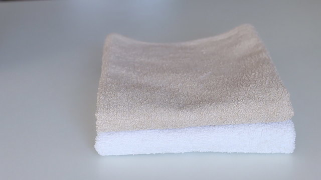 fold towels on white table