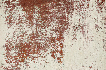 old white cracked paint on rusty metal surface