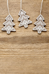 Christmas trees on rough wooden background