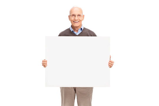 Cheerful senior holding a white signboard