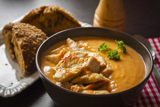 Carrot soup with chicken, bread