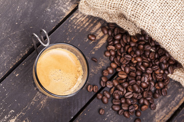 Top view of a cup of coffee on a rustic table