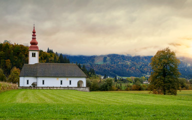 Fototapeta na wymiar Lonely church in the mountain near the Lake Bohinj
