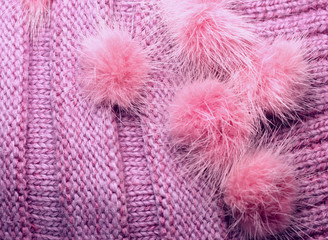 ribbed knit wool like texture with fur pompoms, textured knitted