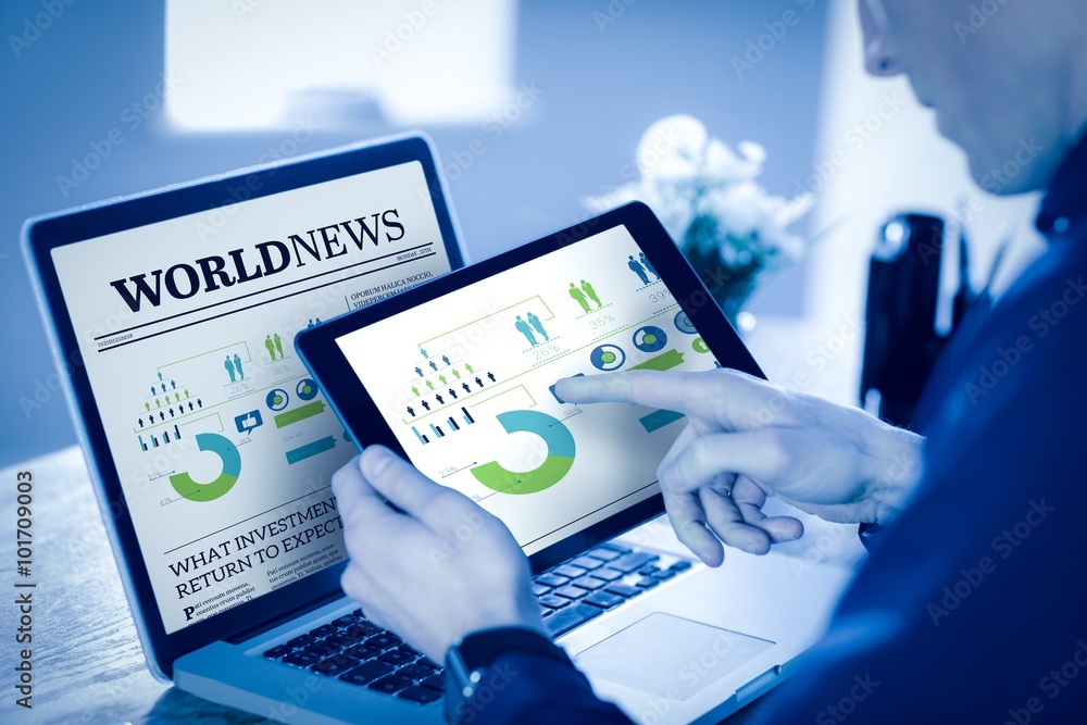 Poster composite image of businessman using tablet computer in office
