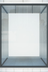 Blank white poster in showcase, mock up