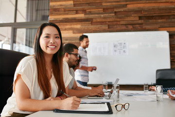 Woman smiling during business presentation