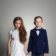 funny beautiful couple. beauty little girl and boy together.kids wedding