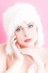 Natural woman portrait with perfect skin wearing fur hat