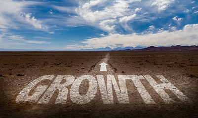 Growth written on desert road