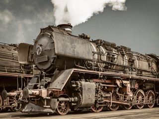 Fototapeta na wymiar Retro styled image of an old steam locomotive