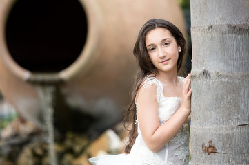 Girl dressed as a first communion in the park