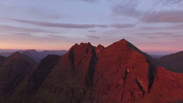 Dramatic aerial shot of An Teallach near Ullapool in the Scottish highlands during sunrise 

