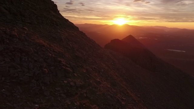 Dramatic aerial shot of An Teallach near Ullapool in the Scottish highlands during sunrise 

