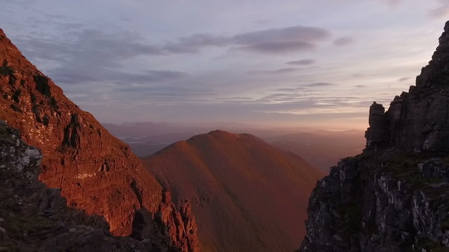 Dramatic aerial shot of An Teallach near Ullapool in the Scottish highlands during sunrise 

