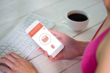 Composite image of woman using her smartphone