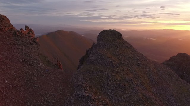 Dramatic aerial shot of An Teallach near Ullapool in the Scottish highlands during sunrise 
