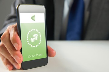 Composite image of businessman using smartphone