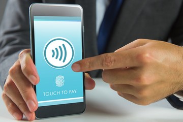 Composite image of businessman using smartphone