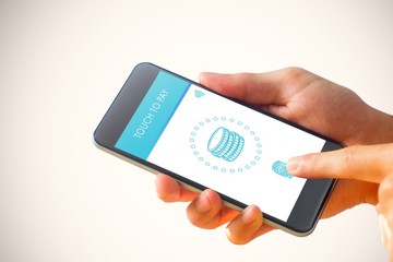 Composite image of hand holding smartphone