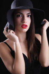 Attractive young woman in hat