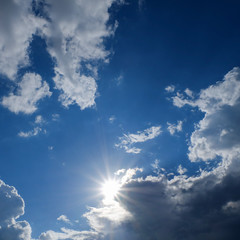 Naklejka na ściany i meble clear weather sky, sun on blue sky with clouds, sun rays