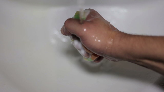 Squeezing Soapy Sponge
