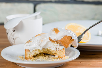 a piece of cake with a lemon on a fork (shallow DOF)