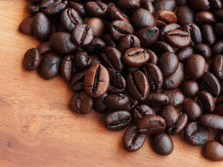 Coffee beans on wood background