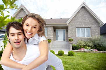 Happy couple near new house.