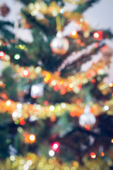 Fototapeta na wymiar blur light celebration on christmas tree, vintage tone