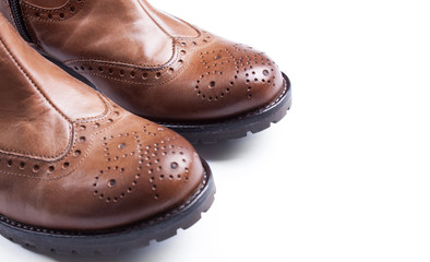 Womens brown suede fashion boots isolated with sample text. Shot