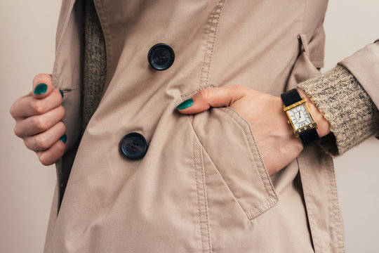 Woman Put Her Hand In Coat Pocket