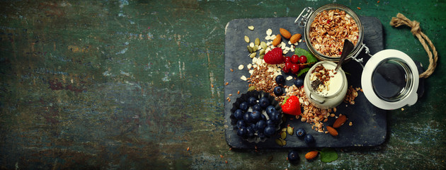 Healthy breakfast of muesli, berries with yogurt and seeds