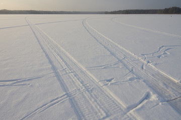 Snowmobile traces on the lake