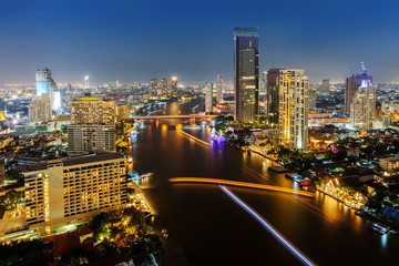 Fototapeta na wymiar Skycrapper view of Bangkok city with rive at night time.
