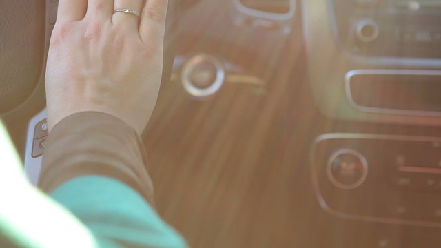 Steering car whell in sunny weather with sun light, human hands