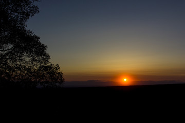 Fototapeta na wymiar Sunset on a dark horizon